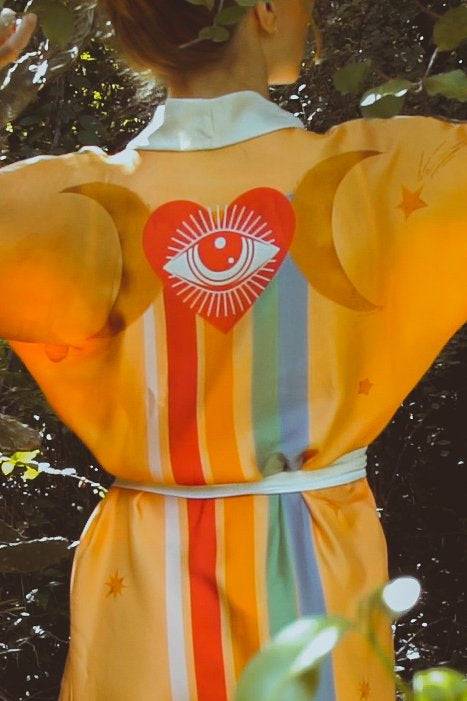 Royal RobeHolding Court IncIntroducing the The Royal Robe in Yucatan Rainbow, a tailored, bespoke kimono crafted from lightweight silk. Perfect for Summer Fashion, this kimono combines elegancPeignoirThe Royal Robe in Yucatan RainbowHolding Court INCHolding Court INCHolding Court INC