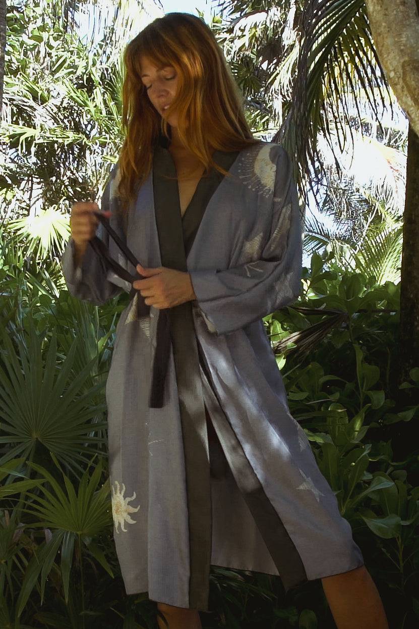 Sky View BlueHolding Court IncThe Royal Robe in Sky View Blue, a tailored, a bespoke kimono crafted from lightweight silk, is perfect for Summer Fashion.  This kimono combines elegance with comfoPeignoirThe Royal Robe in Sky View BlueHolding Court IncHolding Court IncHolding Court Inc