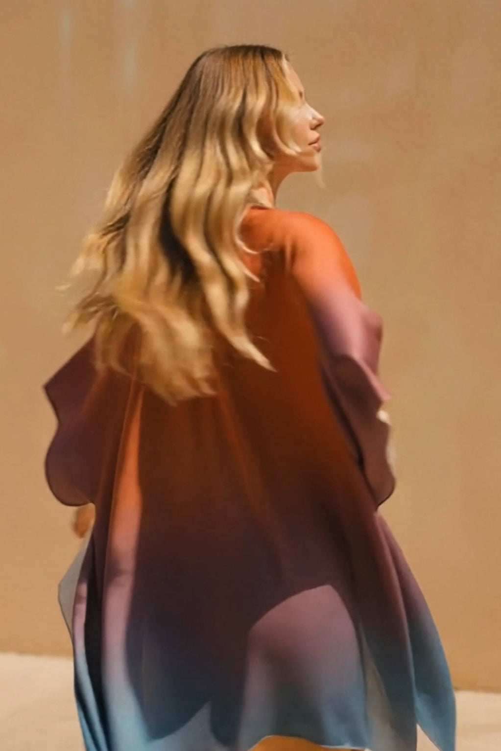 Woman wearing a colorful dress with a blurred background