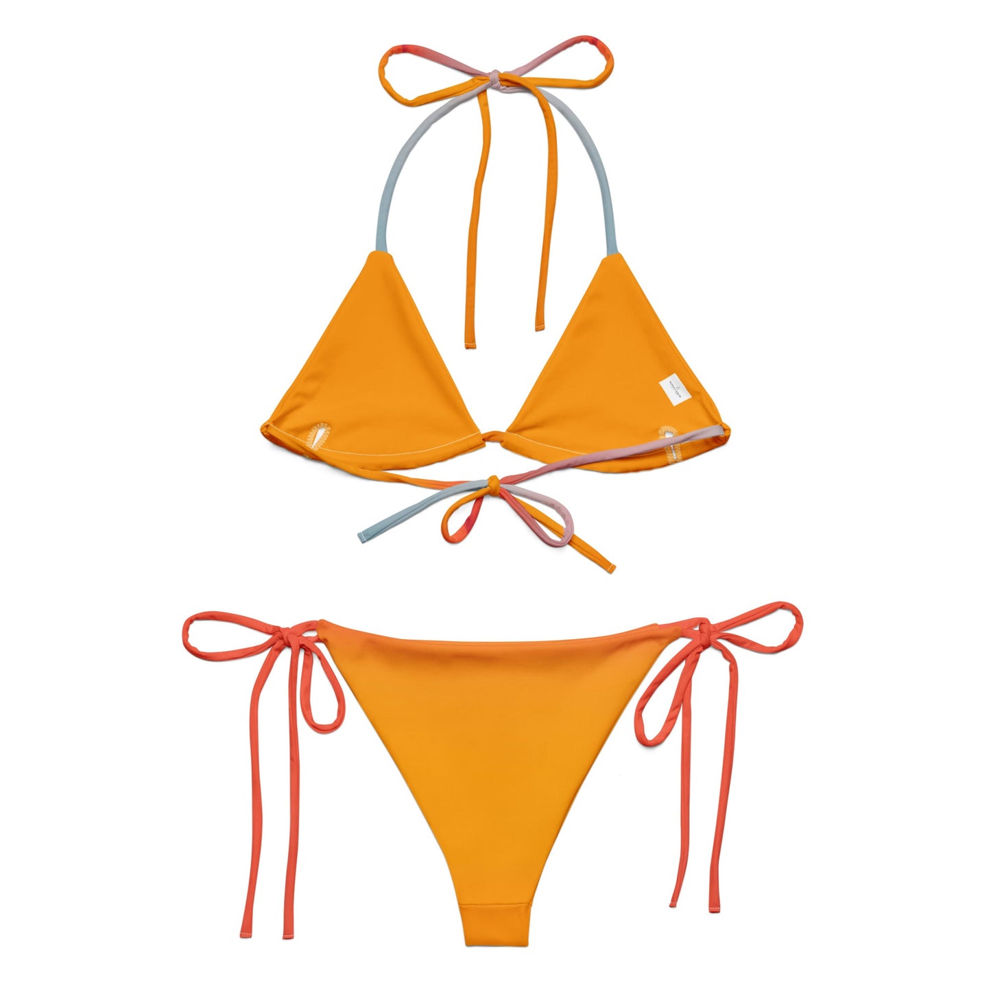 Editorial shot of the rainbow Vega String Bikini in Sunrise — Oeko-Tex certified recycled swimwear, non-toxic and skin-safe, from Holding Court Inc, made to order.