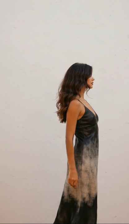 Woman wearing a long, dark-colored dress against a plain background #Griffin1LunarLanding #MoonArt #SustainableFashion #ArtistsForImpact #BitBasel #LunarArtGallery #ReFiTulum #SpaceArt #EcoFashion #MadeToOrder #OrganicCotton #RecycledFabrics #AuroraBorealis #CosmicFashion #RegenerativeFashion #TheRoyalRobe #CourtneyBarriger #HoldingCourtInc #AstroGLPH #MoonMission2026 #EthicalFashion #SlowFashion #ConsciousClothing #EcoLuxury #SustainableStyle #WatercolorArt #CelestialFashion #FromEarthToMoon #ArtInSpace #L