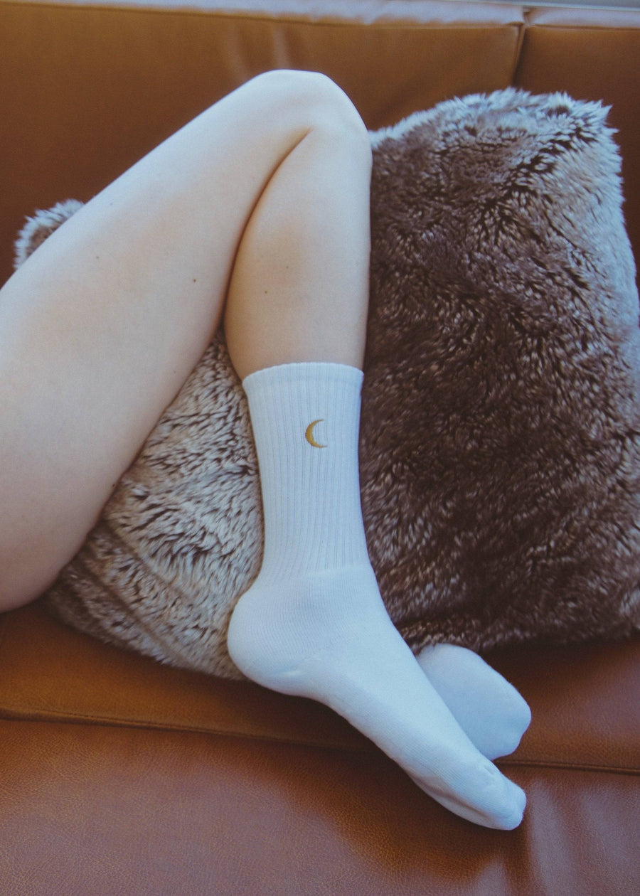 Flat-lay of the Moon Landing Embroidered Socks — organic cotton embroidered socks, ethically made, designed by Courtney Barriger for Holding Court Inc.