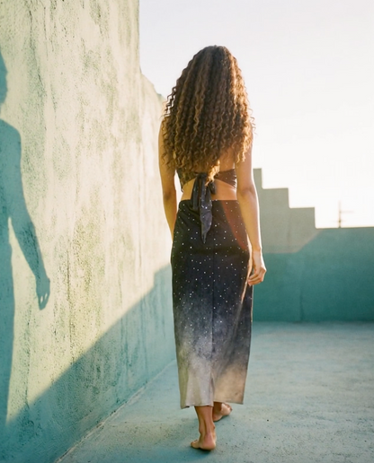 Woman posing in the Maia Silk Skirt in Star Dust - Limited Edition — Oeko-Tex certified silk skirt made from natural fibers, photographed in warm natural light.
