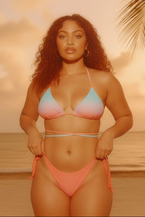 Woman in a bikini standing on a beach with palm trees and sunset in the background